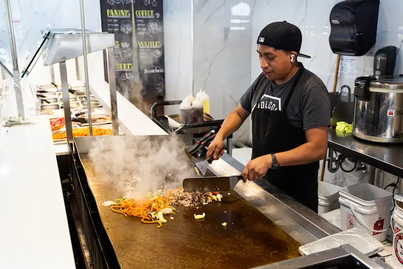 Chef Cooking on Flat Top Grill